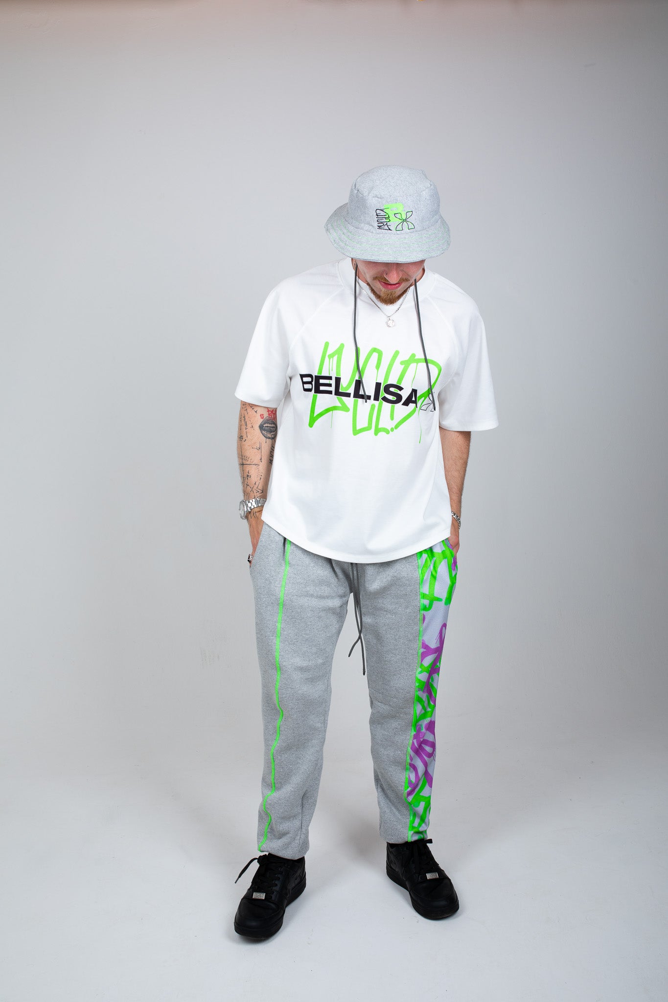 Bellisa X Lucid Independent Bristol Fashion Brand Summer Streetwear Style Festival Look Graffiti X Neon green contrast stitch grey joggers and matching Bucket Hat 2-Piece