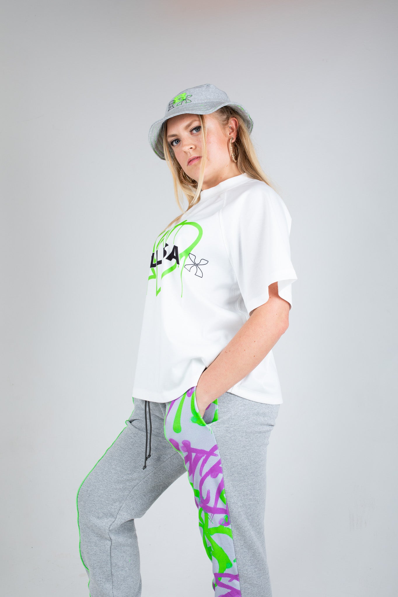 Bellisa X Lucid Independent Bristol Fashion Brand Summer Streetwear Style Festival Look Graffiti X Neon green contrast stitch grey joggers and matching Bucket Hat 2-Piece