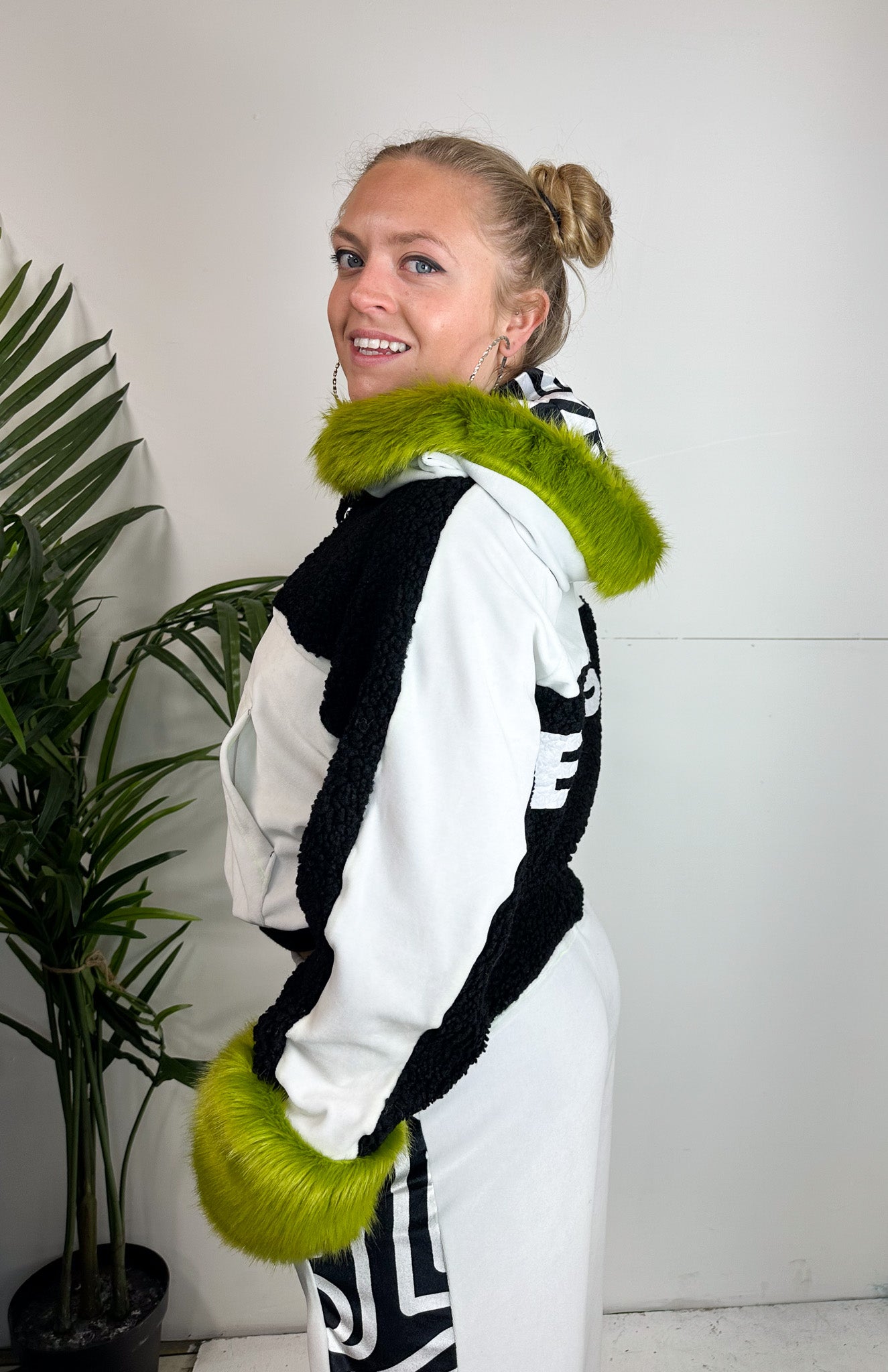 Emerging luxury streetwear designer Bellisa x wears: Bellisa X White and Black Velour Cropped Hoodie with Lime Green Faux Fur Cuffs and Hood. Unique summer fashion hoodie